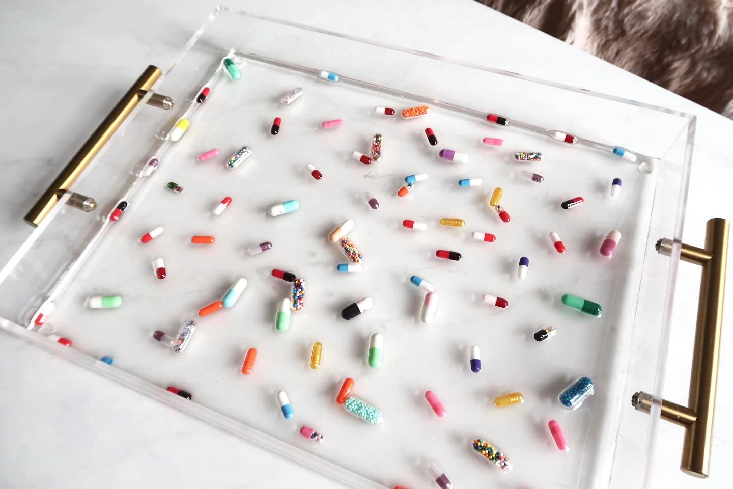 Prozac Platter close-up showing colorful capsules cast in clear acrylic