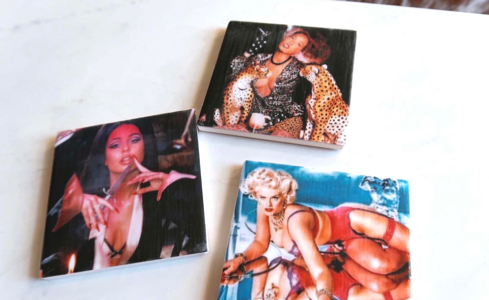 Close-up of three Icon Coasters with vintage film imagery